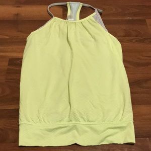 Light light green with some grey on the inside ivivva tank top